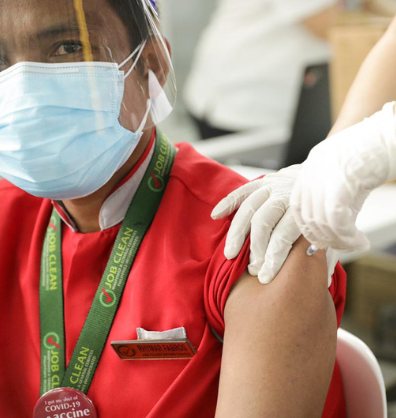 Health worker vaccinated in the Philippines